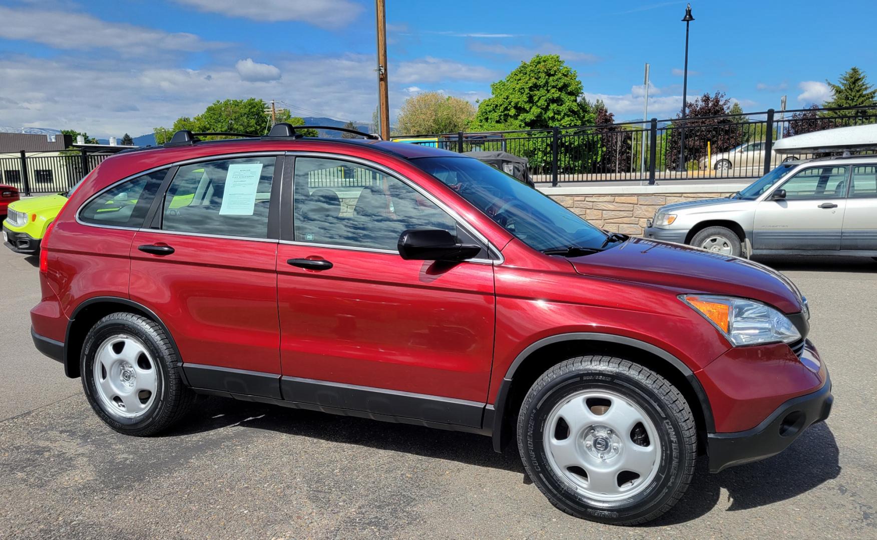 2009 Red /Gray Honda CR-V LX (5J6RE483X9L) with an 2.4L L4 engine, 5 Speed Automatic transmission, located at 450 N Russell, Missoula, MT, 59801, (406) 543-6600, 46.874496, -114.017433 - Great Running AWD SUV. 2.4L I4 Engine. 5 Speed Automatic Transmission. Air. Cruise. Tilt. Power Windows and Locks. New Tires. Roof Rack. Does have a Rebuilt Title so financing is not available. - Photo#4